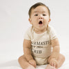 Baby wearing 'Namaste in My Crib' onesie