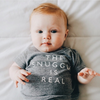 Baby wearing 'The Snuggle is Real' tee